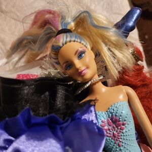 Lot of fashion dolls and clothes